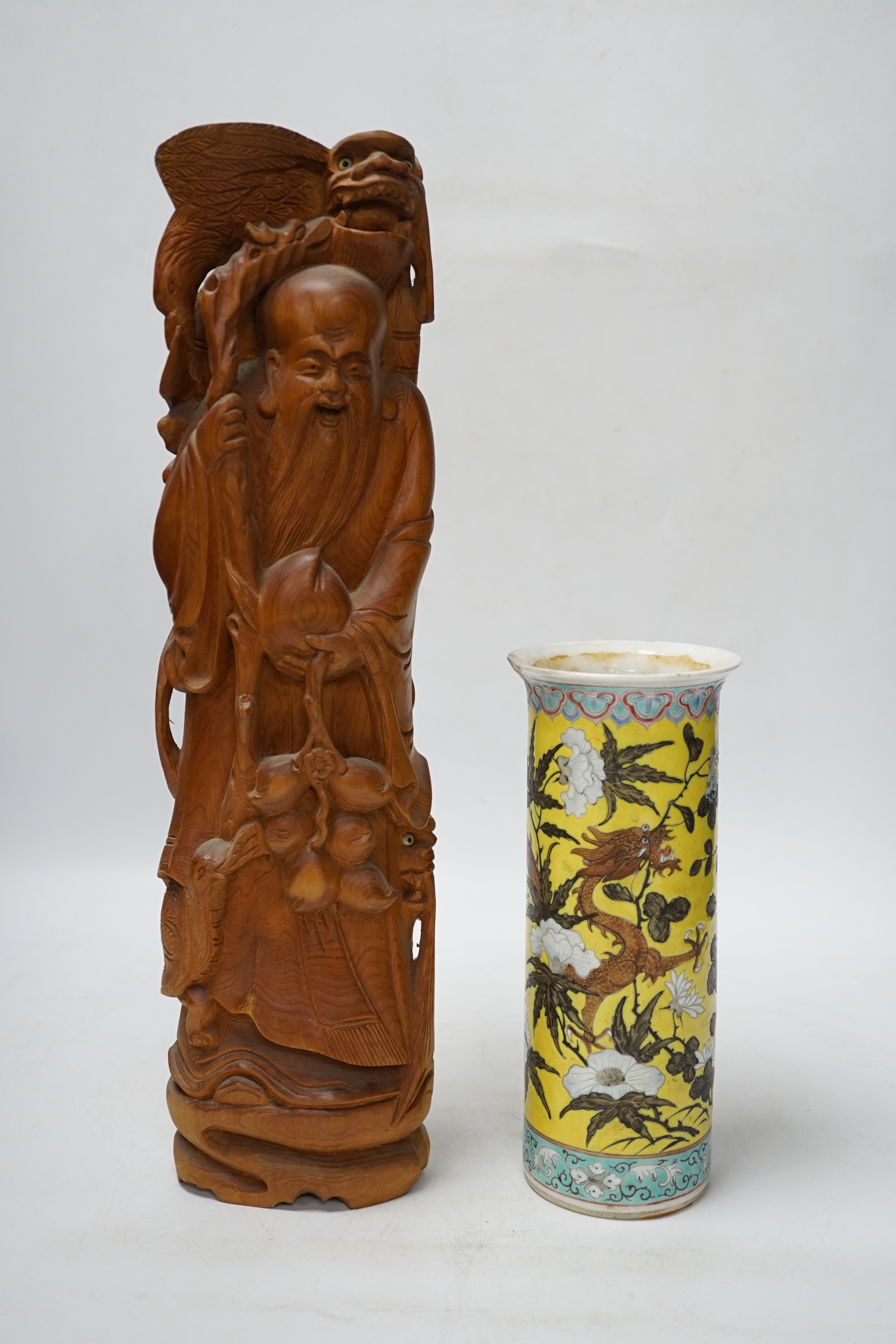 A Chinese carved wood figure of Shou Lao and a Chinese 'dragon' vase, largest 39cm high